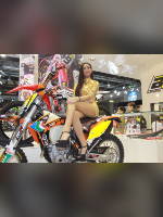 photo from the publication "EICMA 2013", author themax2, Tags: [exhibitions, Italy, events of 2013, Milan, yellow dress, sitting legs crossed, dress very short (mini-dress), dress fitting, tight, slinky, events, sitting sideways on a motorcycle, , , Europe]