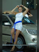 photo from the publication "Interauto 11. WHA.", author Эдуард@fotovzglyad, Tags: [exhibitions, pantyhose (tights) skin color, Anna (Anya) Kasyanova, short dress, dress white, Moscow, car, Interauto and MIMS, Russia, events of 2011, lifting leg, dress fitting, tight, slinky, events, girls AvtoVAZ, car show]