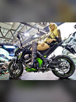 photo from the publication "EICMA 2012", author Andrea Gianotti, Tags: [exhibitions, black boots, Italy, blonde, boots above the knee (jackboot), Milan, sitting legs crossed, high heels, events, sitting sideways on a motorcycle, , , Europe]